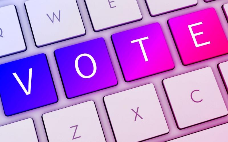 Edital Arte com a palavra "vote" com cada uma das letras da palavra vote em uma tecla de um teclado de computador