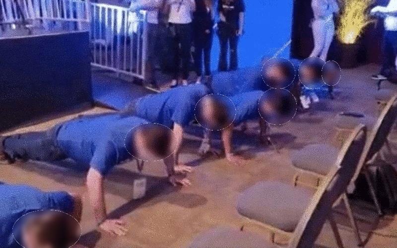 Reprodução Empregados de alto escalão da Caixa fazem flexões no evento Nação Caixa
