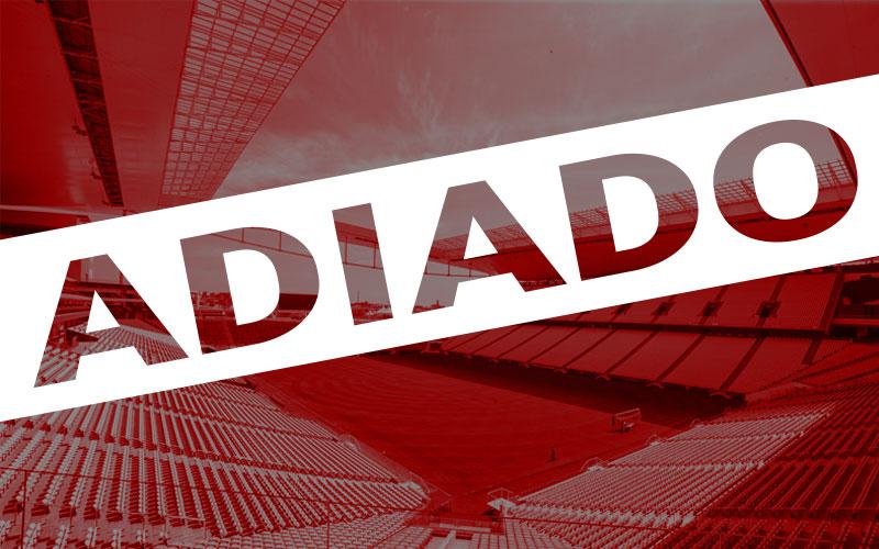 Foto: Paulo Pinto / Fotos Públicas Arte com a foto do estádio vazio do Corinthians ao fundo, sob um filtro vermelho, sobreposto a palavra "adiado"