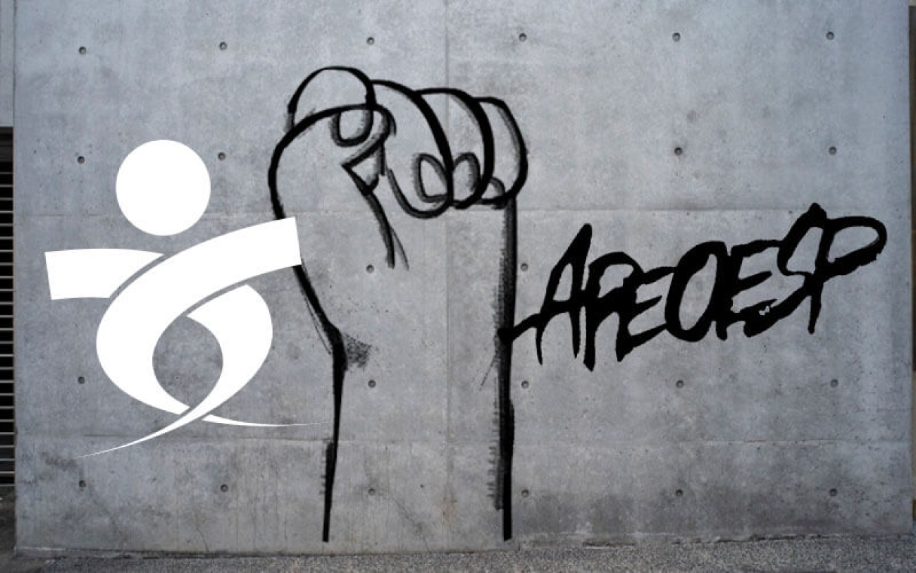 Imagem composta dos logos do Sindicato dos Bancários de São Paulo e da Apeoesp, lado a lado, em um muro. No meio deles, um grafite de punho cerrado