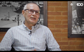 Manoel Elídio cabelos grisalhos, camisa e óculos em entrevista sobre os 100 anos do Sindicato