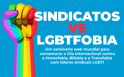 Arte com um punho erguido pintado com as cores do arco-íris e com o texto "Sindicato vs. LGBTfobia.