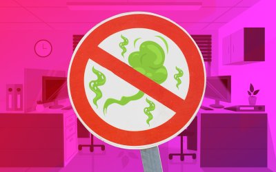 Imagem de um escritório, com uma placa de proibido futum