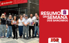 Dirigentes do Sindicato, em frente a uma agência do Santander, acompanhados do logo do Resumo da Semana (Divulgação)