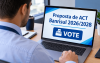 Homem diante de uma tela de computador onde se lê: Proposta de ACT Banrisul 2026/2028 Vote"