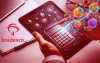 Imagem de uma calculadora sobre um papel com o logo do bradesco