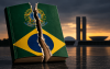 Imagem feita por Inteligência Artificial mostra o livro da Constituição Federal rasgado em primeiro plano e, ao fundo, o prédio do Congresso Nacional sob o entardecer