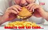 Imagem mostra homem comendo um hamburguer, em frente a um prato de batatas fritas. Na parte inferior, o texto "barato que sai caro". No canto superior direito, o logo da CUT (Central Única dos Trabalhadores)