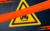 Imagem de um símbolo de um risco de incêndio com uma tarja vermelha